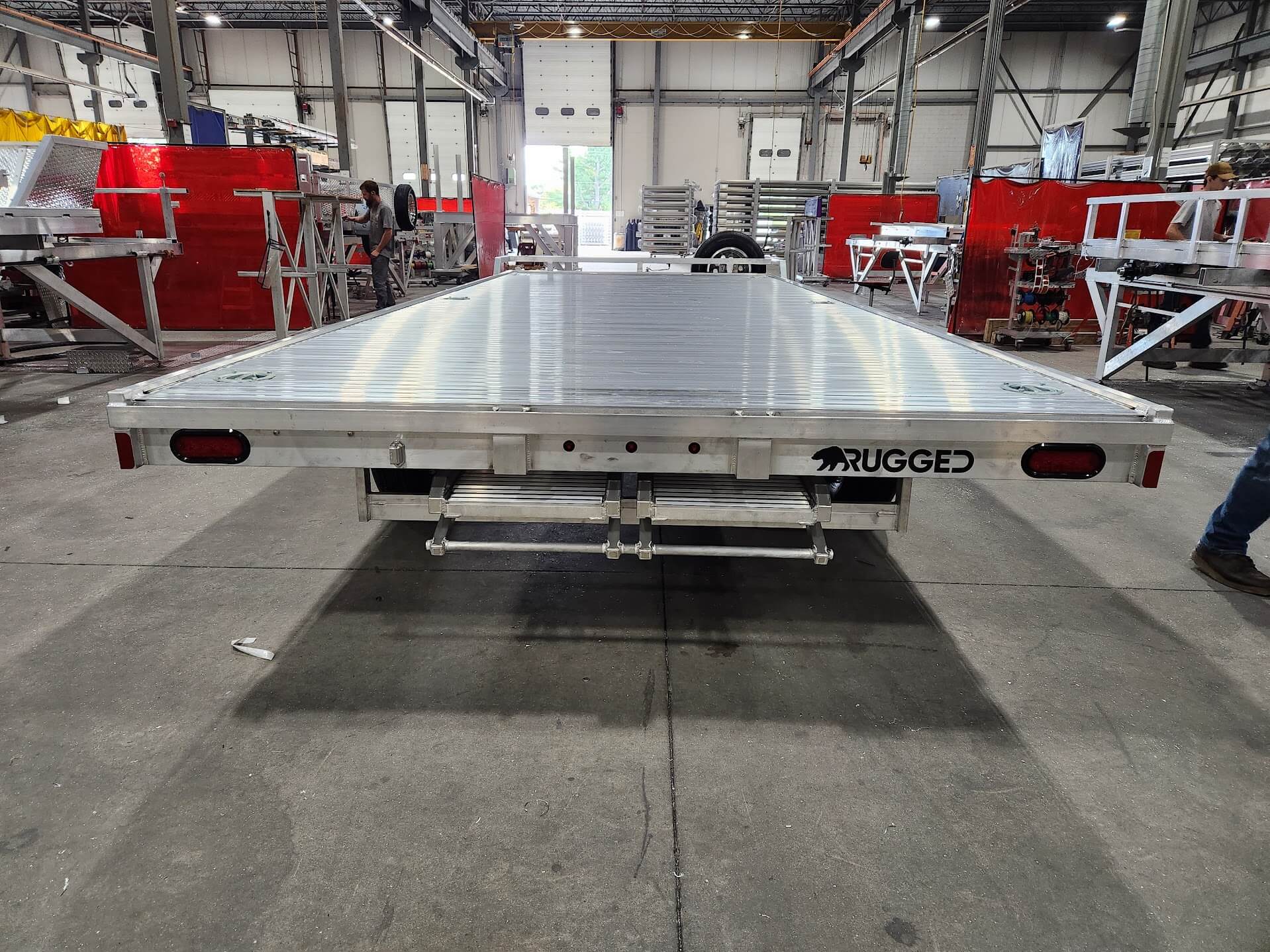 A Rugged 8x20 all-aluminum deckover trailer on the Hudson, New Hampshire build floor.