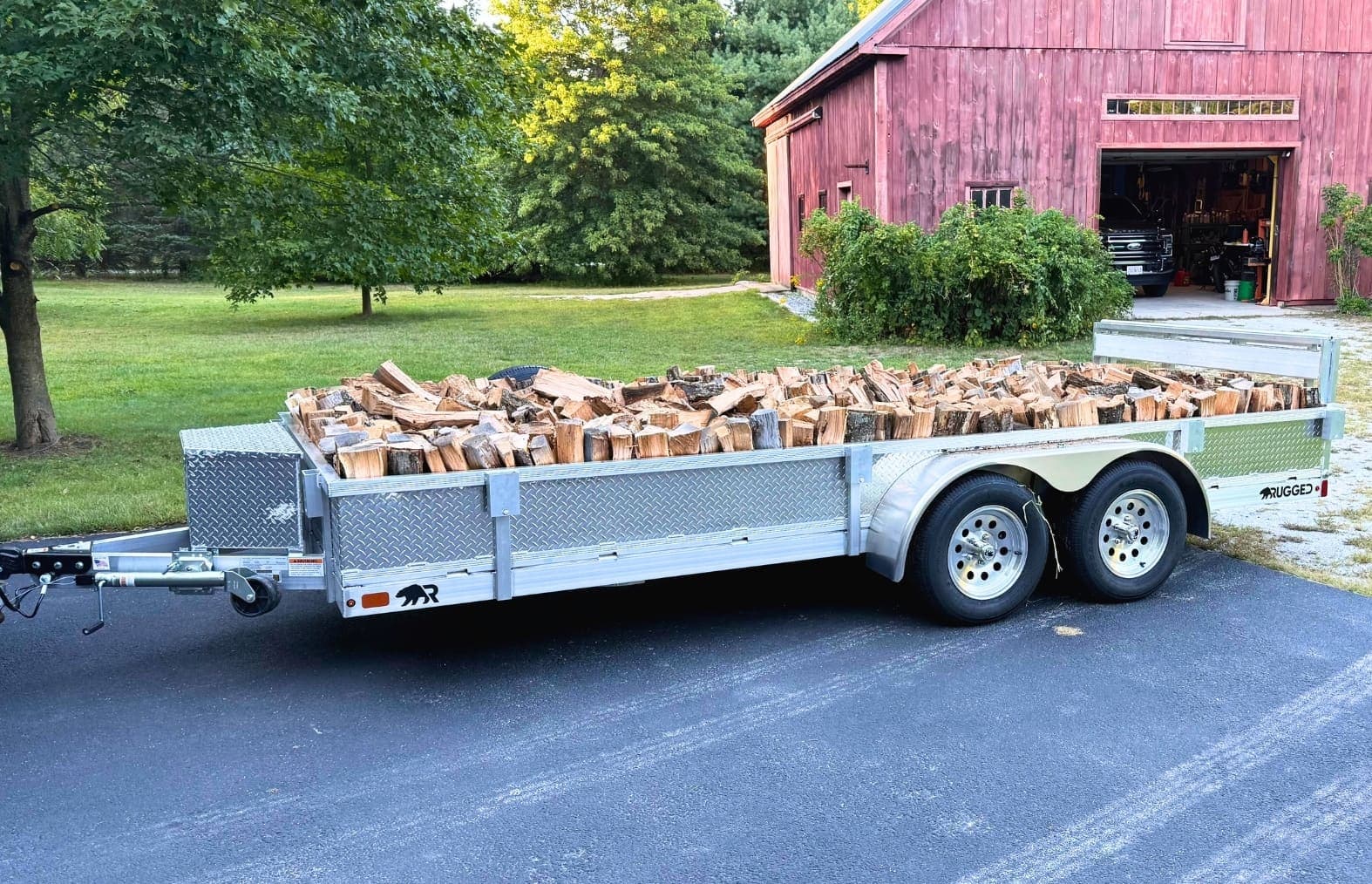 Real Rugged utility trailer carrying a secured material load