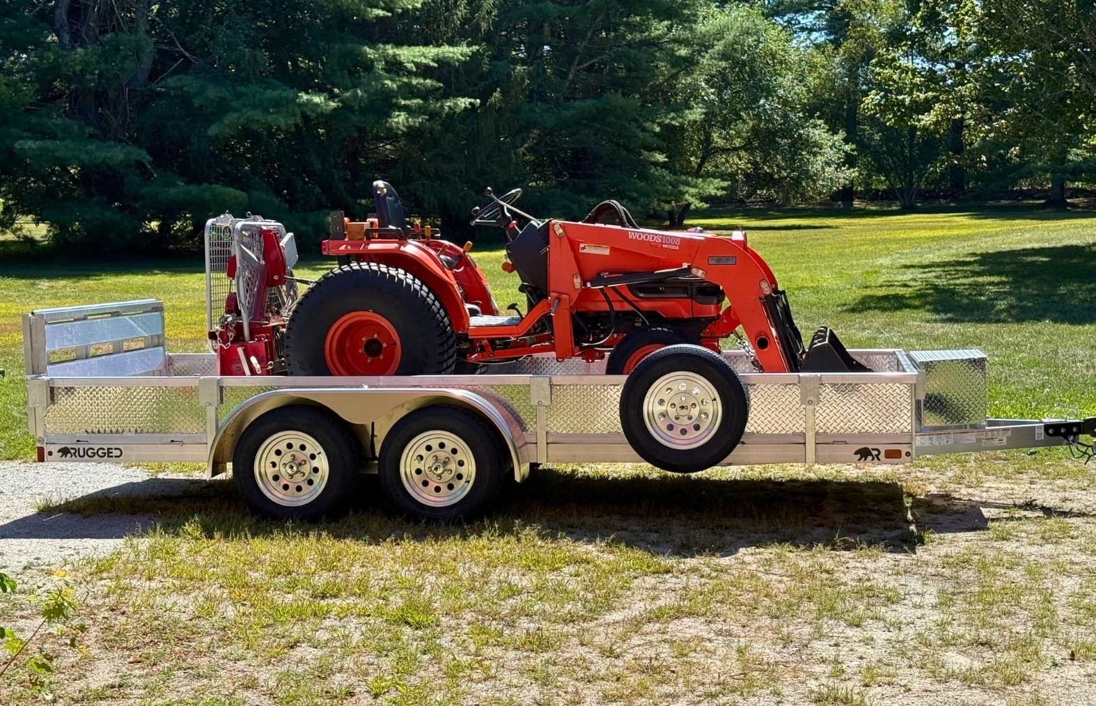 Real Rugged utility trailer carrying compact landscape equipment